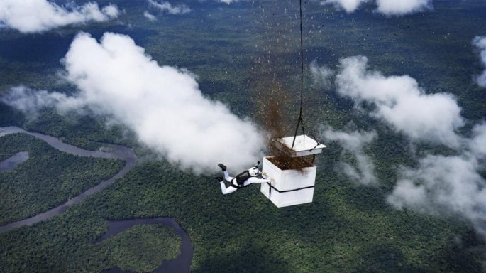 Skydiver scatters more than 100 million seeds over a deforested patch of the Amazon.
